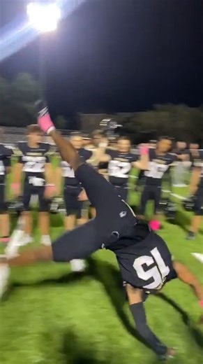Football Players Perform Flips After Their Team Wins