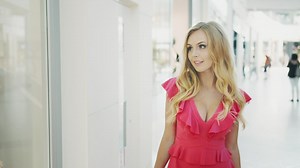 Woman walking through the corridors of a mall - Free Stock Video