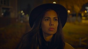 Professional Female Photographer Using DSLR Camera Capturing Photos