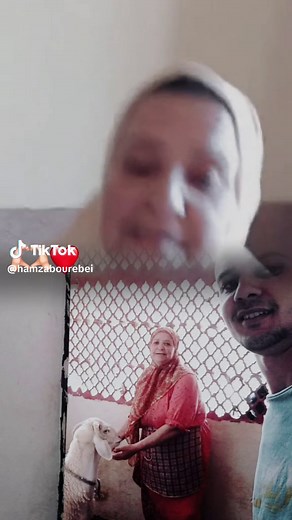 Woman Interacting with Goat in Red Dress