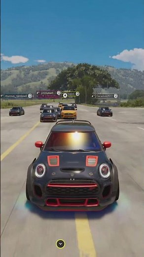 Mini Cooper Race: Thrilling Track Action and Mountain Views!