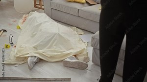 A detective analyzes crime scene evidence indoors, with a focus on a body outline, bloodstains, hammer, glasses, and a walkie-talkie.