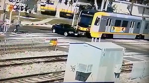 Driver survives with only ‘scrapes and bruises’ after being run over by train at level crossing