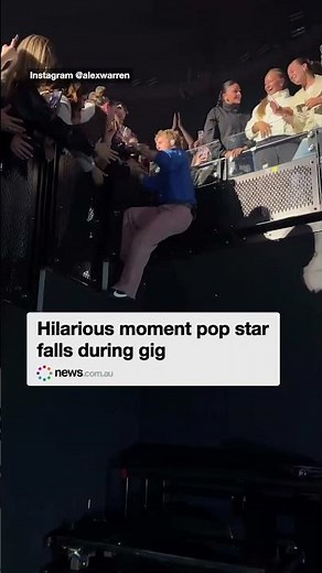 Hilarious moment pop star falls during gig