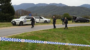 Australian police hunt for gunman who killed two officers and shot another in a rural town
