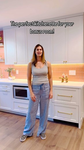 🤜 Make your bonus room a destination! 🍿🍹 From popcorn to drinks, a kitchenette or wet bar will get people excited to spend time in the space. Cabinets by @precisioncabs Hardware by @rejuvenation Counters by @vadaraquartz Plumbing by @graff_designs Tile by @wow_designeu Electrical by @vegaelectricservices #kitchen #kitchenette #kitchenremodel #bar #builtin #builtins #whitecabinets #pinktiles #floatingshelves | In the Deets