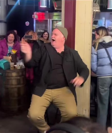 Lively Pub Gathering: Dancing and Socializing Fun