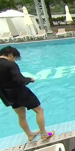 Preparing for a Dive at a Scenic Pool