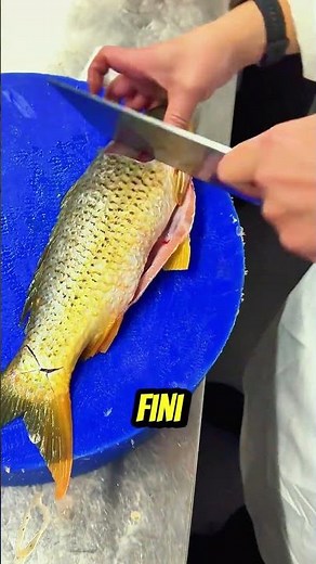 Master the preparation of fish: descaling and gutting.