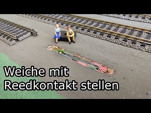 Set railway switch by reedrelais