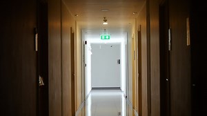 Download inside the apartment building has signs and fire escape doors in the building, Fire escape in a high rise building for free