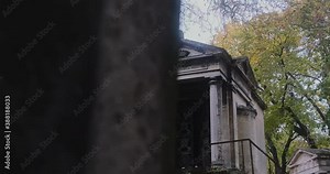 a mysterious family vault in the pere lachaise cemetary the metal door is half-open