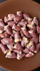 Raw heart, red duck internal organs as an ingredient for dinner preparation