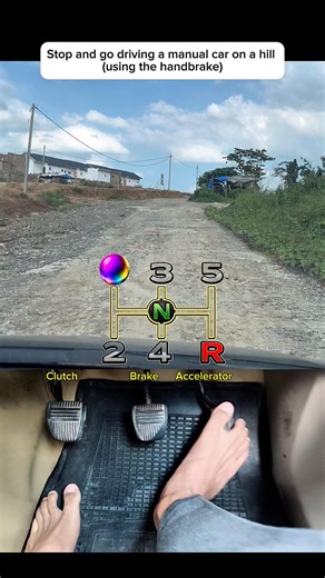 Stop and go driving a manual car on a hill (using the handbrake) #shorts