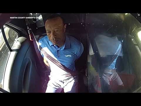 Bodycam shows a stunned Tiger Woods handcuffed after a Florida rollover crash