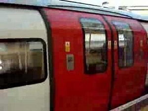 Jubilee line underground train arrives at Neasden station