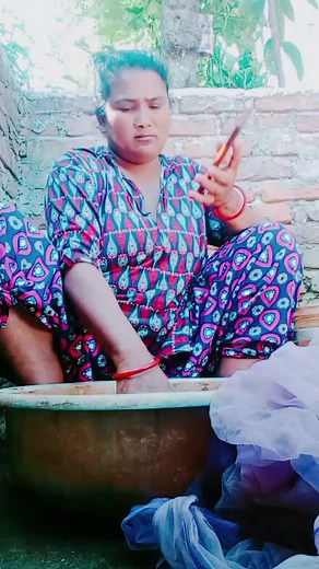 Outdoor Cloth Washing in a Rusty Basin