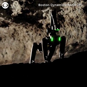 Boston Dynamics' dog-like robot, Spot, has been given artificial intelligence to autonomously explore caves, preparing it for possible future Mars missions. | CBS News