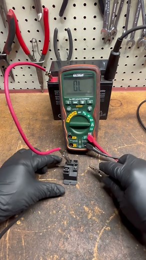 Testing a relay with a battery.
