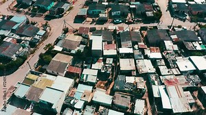Poor, community and houses in a neighborhood from drone with village, street and landscape of South Africa. Township, location and rooftop of shack property, settlement or homes on a road in ghetto