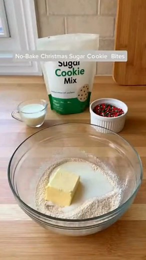 No-Bake Christmas Sugar Cookie Bites Frosted Holiday Sugar Cookie Bites Delight Ingredients: 2 cups crushed holiday sugar cookies 1 cup cream cheese, softened 1 cup white chocolate, melted 1/3 cup Christmas sprinkles Directions: Add crushed holiday sugar cookies to a mixing bowl. Mix in softened cream cheese until a soft dough forms. Roll the mixture into small bite-sized balls and place on a parchment-lined tray. Dip each ball into melted white chocolate and allow excess to drip off. Place back