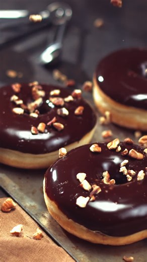 Chocolate Glazed Donuts with Nuts on Top - Free Stock Video