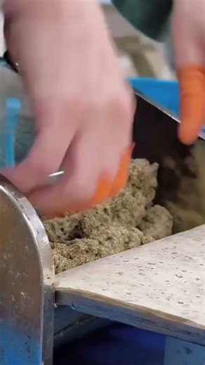 the process of inserting a filling into the dough which will then be folded using a special tool