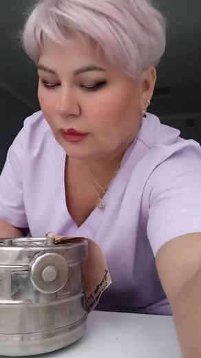 Cleaning a Large Metal Container in Indoor Workspace