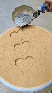 Three heart shapes revealed in a single smooth metal casting 🔥 Soft curves, clean outlines, and a shiny metallic finish give this piece a calm, artistic feel. Watching molten metal turn into perfect heart forms creates a relaxing ASMR moment. #heartcasting #metalartwork #sandmoldcasting #moltenmetalpour #foundryreveal #asmrmetal #satisfyingwatch #shortsviral | Metal Craft Zone