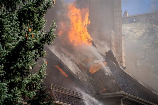 ‘Gone in a day’: Neighbors react as firefighters continue to battle house fire in Sandy