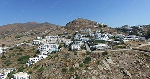 flight over the town of Ios with its beautiful white houses and churches