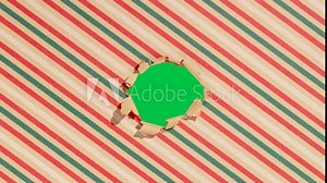 Unwrapping gift revealing a green screen - Stop Motion Animation - Red bow on craft Christmas background