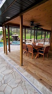 Insane Pool recently completed in Central Florida. This backyard has a huge grotto, a waterslide, a big spa, a swim-up bar, a screened enclosure, a fire pit, and a lifeguard stand. #insanepools #lucaslagoons #pool #poolbuilders #backyard #luxurylife #waterslide | Lucas Lagoons