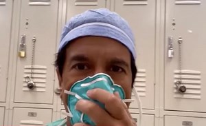 Dr. Sanjay Gupta shows how he wears a mask for hours while he operates. “We’re basically told to reuse the same mask as long as we can... It digs into your face and it hurts after a while. But you do everything to protect it; it’s like gold." | CNN Replay