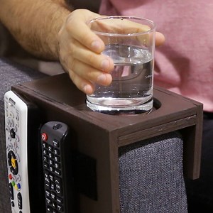 No room for a coffee table in your living room? This couch cup holder is the perfect resting place for your beverages (and remotes, too)! | Tasty Home