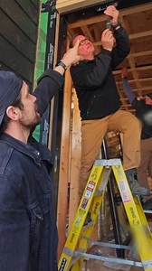 Why should you choose a pivot door? The design is made to ease your install! Watch the Modern Craftsman explain more install tips in their behind-the-scenes video. | Andersen Windows Doors