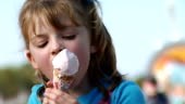 Young girl eating ice cream cone