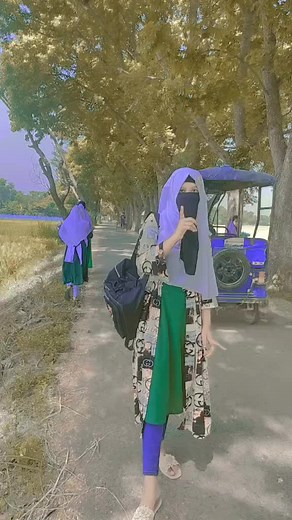 Traditional Attire Walk Through Scenic Rural Pathway