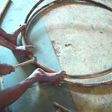 The Art of Traditional Wooden Swing Making: Crafting a Roof-Supported Swing