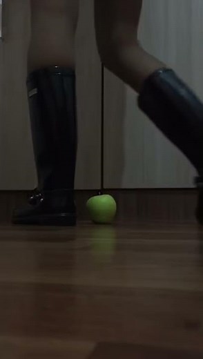Flat boots crushing aplle