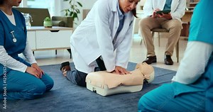 First aid, training and doctor with cpr on dummy for cardiac arrest, emergency healthcare and life saving lesson. Medical simulation, people and learning chest compression for heart attack survival