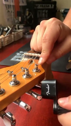guitar string installation and tuning techniques. #shorts
