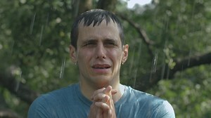 Crying and sad man prays in the rain - Free Stock Video