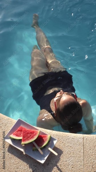 Summer Pool Relaxation: Swimming with Fresh Watermelon