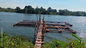 freshwater fish farms using simple partitions in freshwater rivers so as not to damage freshwater ecosystems