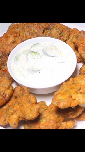 6.6K views · 85 reactions | There are a few things that seem to be common in most people around the world, and one of those things is a love for fried food, who can resist crispy or crunchy food pipping hot from a fryer? Not me, and most probably not you! This Lebanese ejji is so easy to make and you’ll get perfectly crispy fritters every time. Link to the recipe is in the comment section. #ejji #hadiaslebanesecuisine | Hadia's Lebanese Cuisine | Facebook