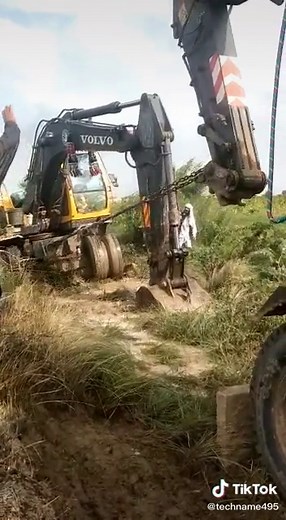 VOLVO Excavator in Action: Digging in Rural Landscape