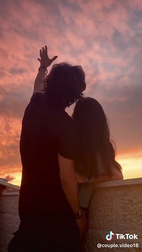 Couple's Sunset Kiss at the Beach