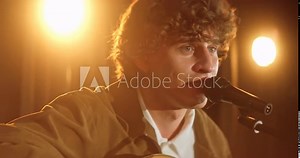 CU Student performing a guitar solo during school or college concert on stage