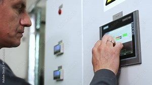 Factory worker touch screen display. Engineer working with industrial computer equipment. Industrial control screen. Close up of control panel screen. Factory man hands touch control monitor Stock Video